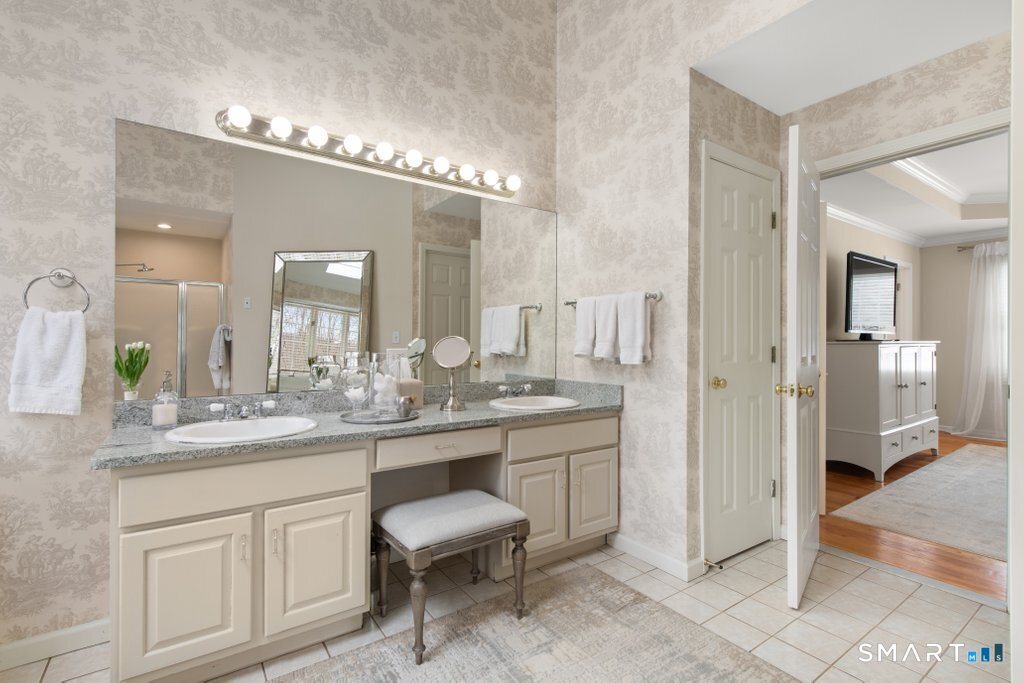 3 Owl Ridge Lane Sandy Hook, CT 06482 - Photo 33 of 40 a bathroom with a granite countertop sink a toilet and a mirror
