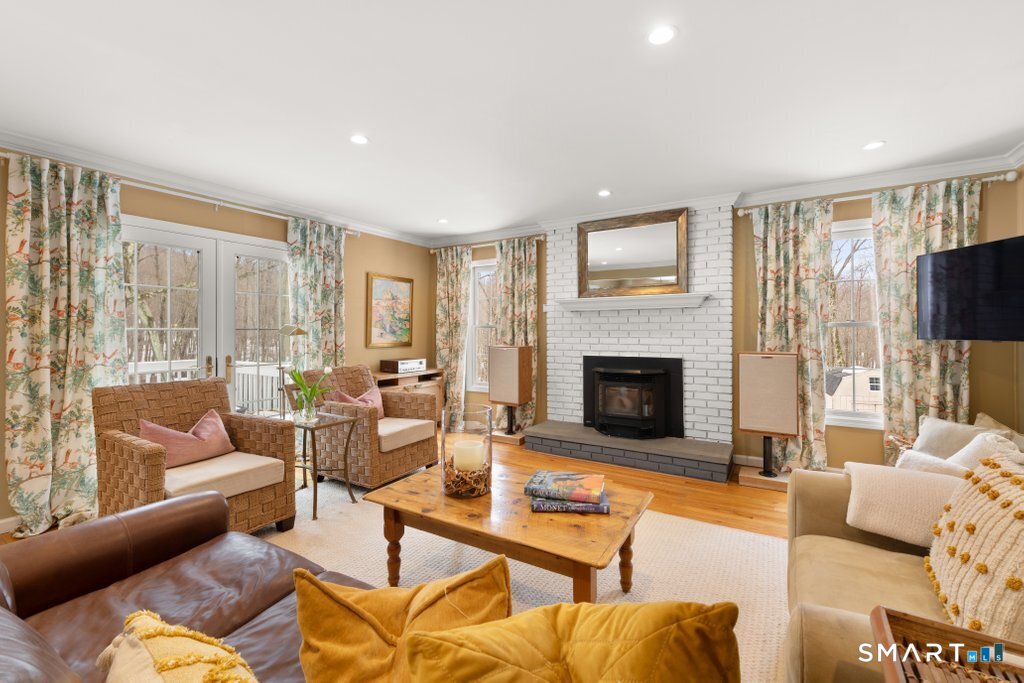 3 Owl Ridge Lane Sandy Hook, CT 06482 - Photo 6 of 40 a living room with furniture fireplace and a flat screen tv