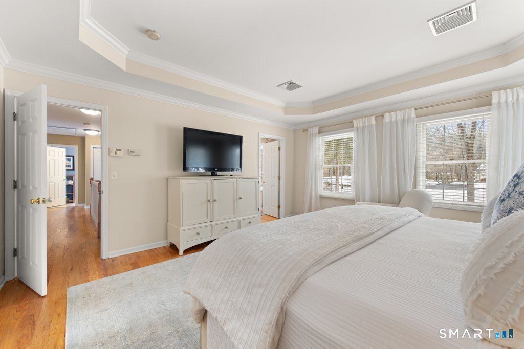 3 Owl Ridge Lane Sandy Hook, CT 06482 - Photo 9 of 40 a bedroom with a bed and a flat screen tv