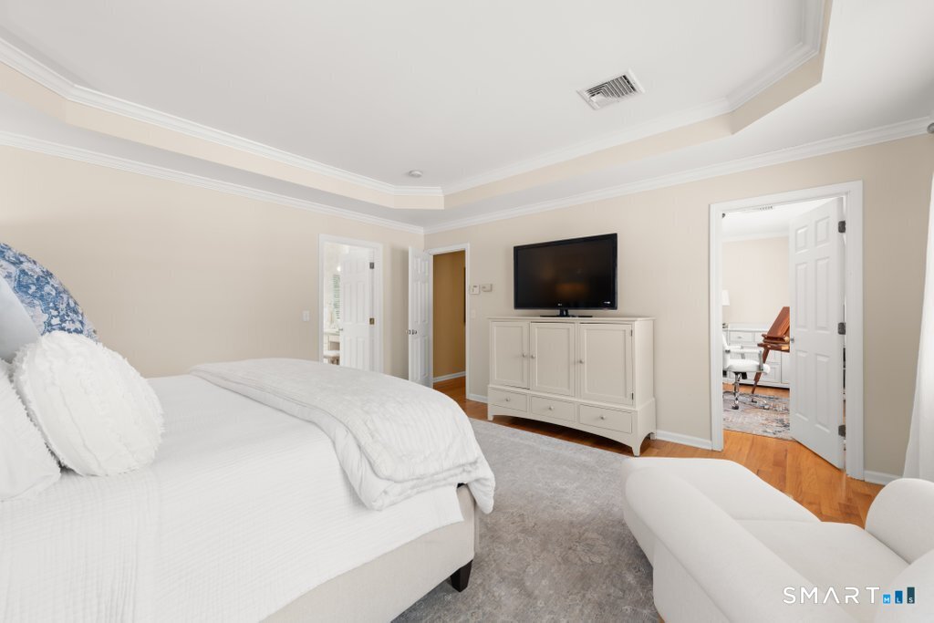 3 Owl Ridge Lane Sandy Hook, CT 06482 - Photo 10 of 40 a bedroom with a bed and a flat screen tv