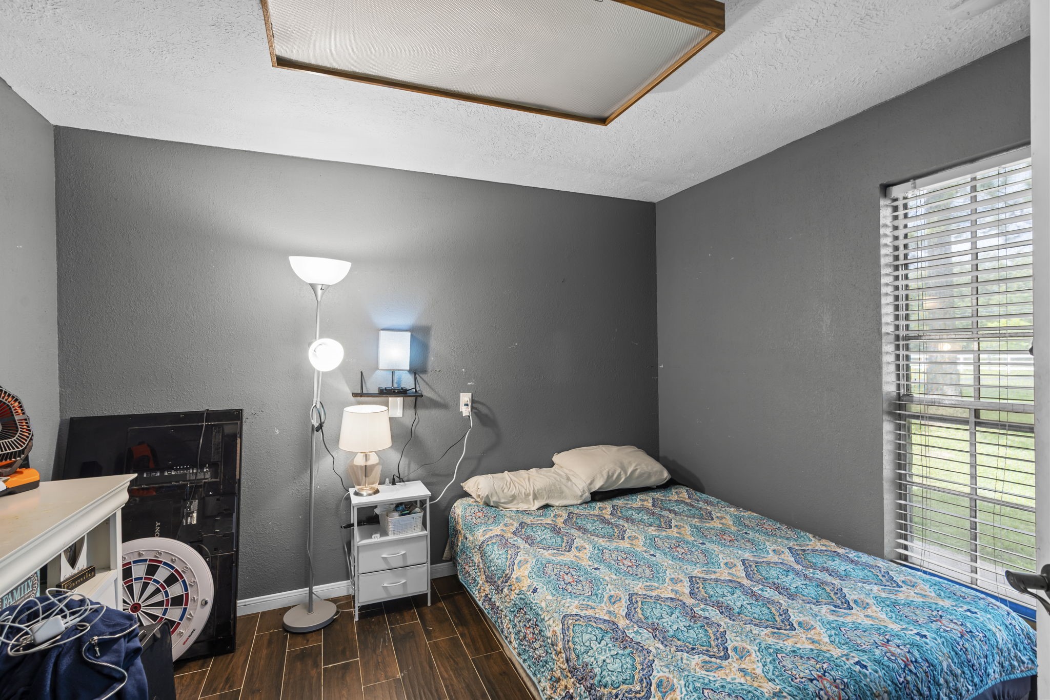 7009 Avenue R Santa Fe, TX 77510 - Photo 19 of 48 Downstairs bedroom but could also be office/flex room. Has 1/2 bathroom right before entrance.