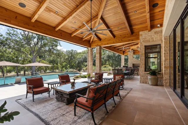 a view of an outdoor sitting area with a fireplace