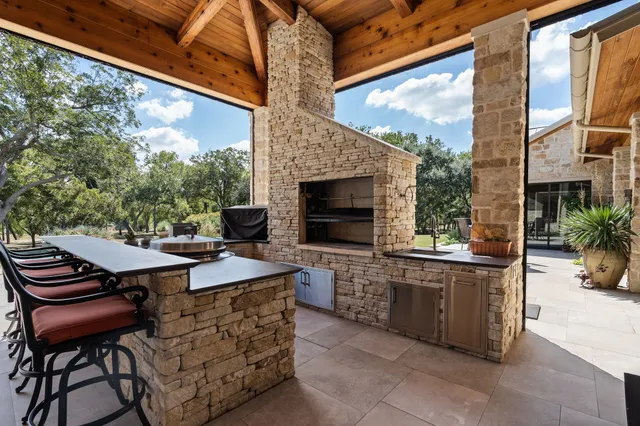 a view of a patio with a table and chairs