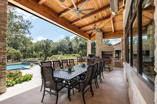 a living room with patio furniture and a flat screen tv