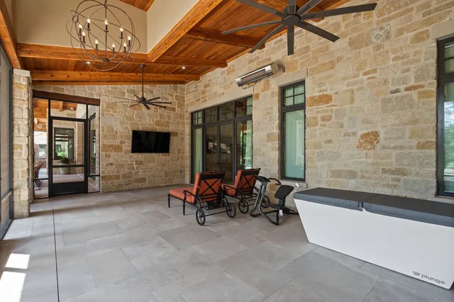 a view of a chairs and a table in a patio