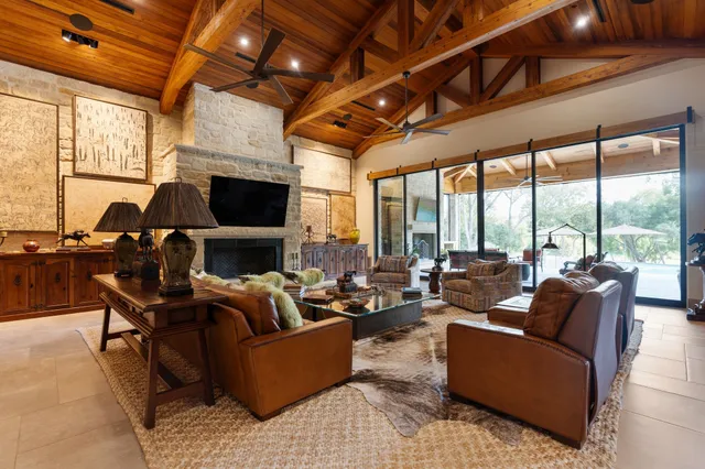 a kitchen with granite countertop a table and chairs in it