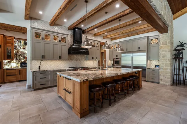 a living room with pool table and a large window
