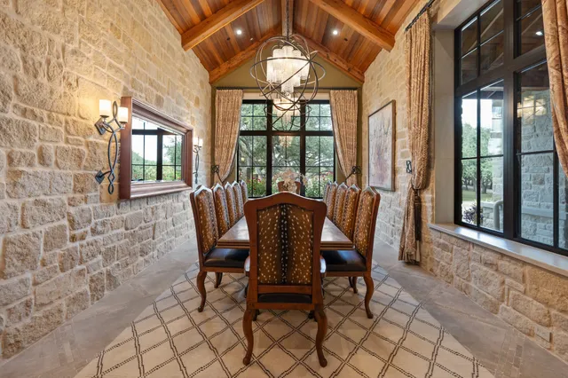 a kitchen with stainless steel appliances granite countertop a refrigerator and a stove