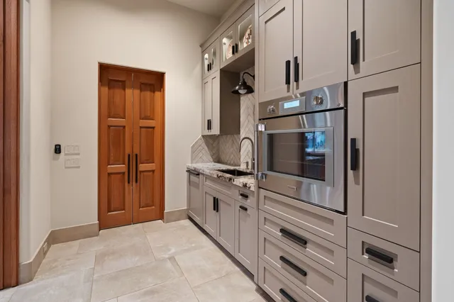 a kitchen with a refrigerator and a sink