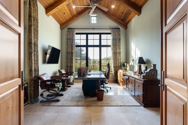 a view of a dining room with furniture and window