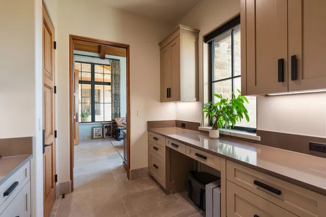 a bedroom with furniture and a flat screen tv