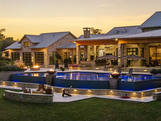 a view of house with outdoor space swimming pool and outdoor seating