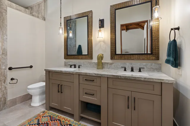 a kitchen with a stove sink and cabinets