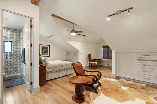 an aerial view of a house with a yard basket ball court and outdoor seating