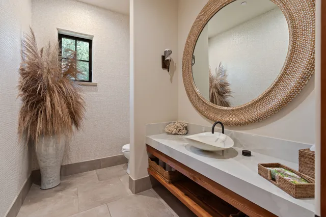 a view of a house with swimming pool and sitting area