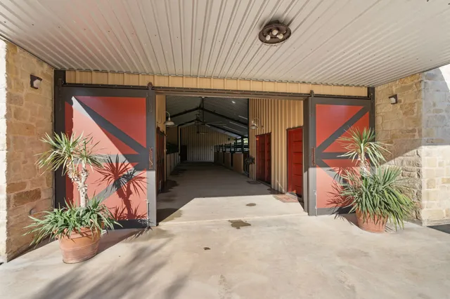 a bedroom with two beds and a window