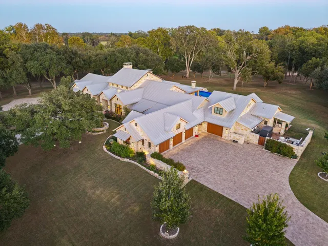 an aerial view of a house with a garden