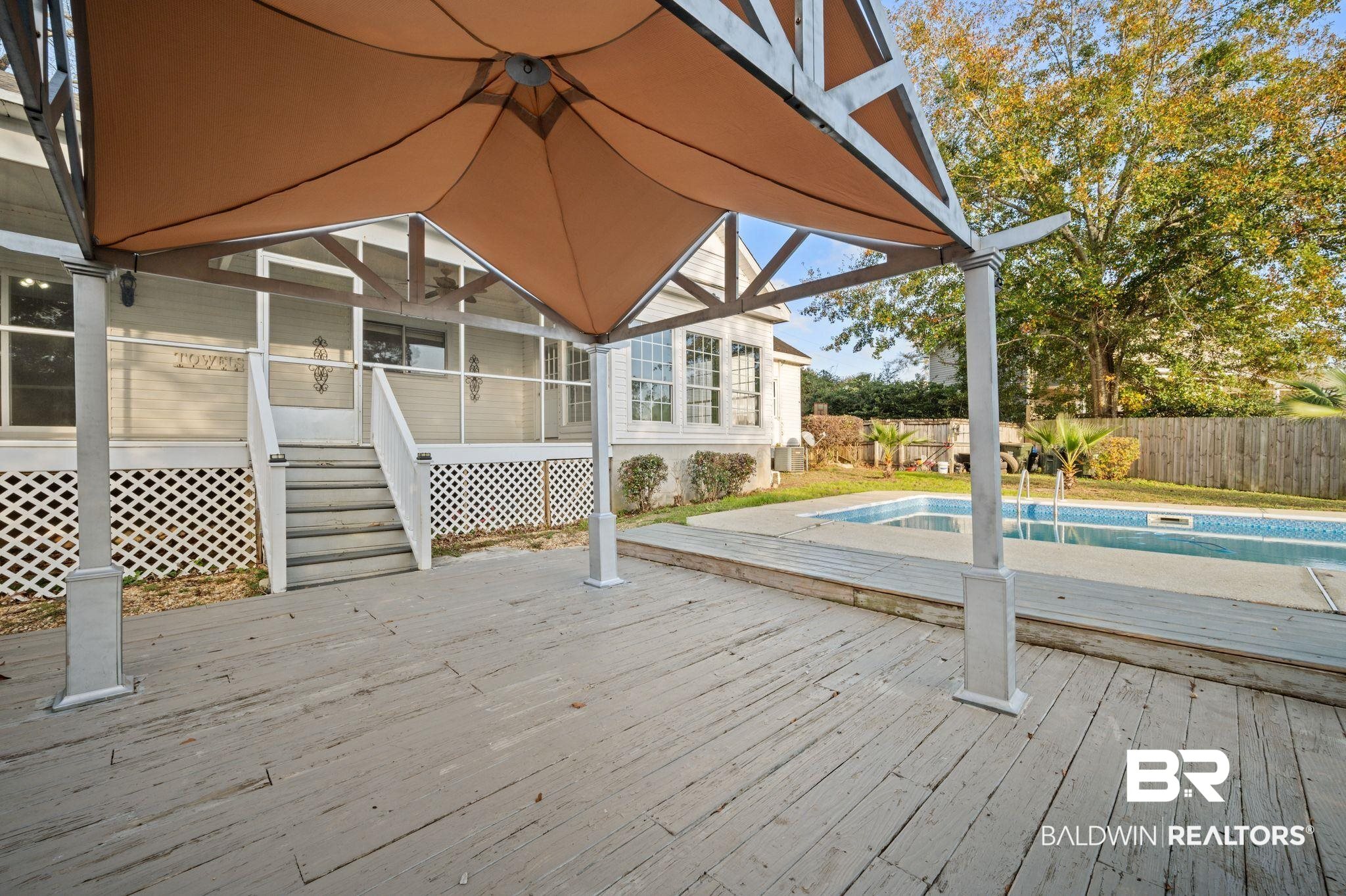 100 Orleans Way Daphne, AL 36526 - Photo 29 of 31 Deck with a fenced in pool