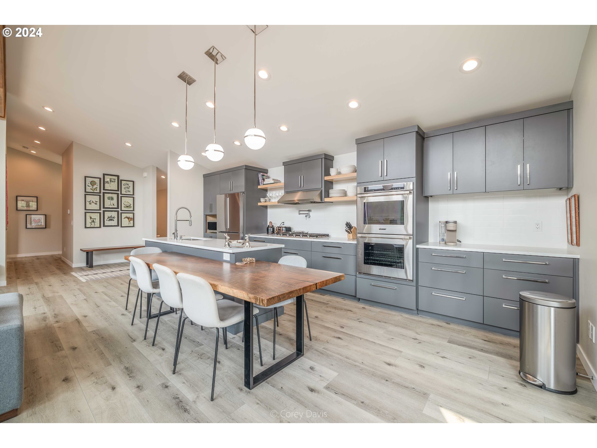 8760 Mariners Nehalem, OR 97131 - Photo 16 of 40 a kitchen with stainless steel appliances kitchen island granite countertop a sink and cabinets