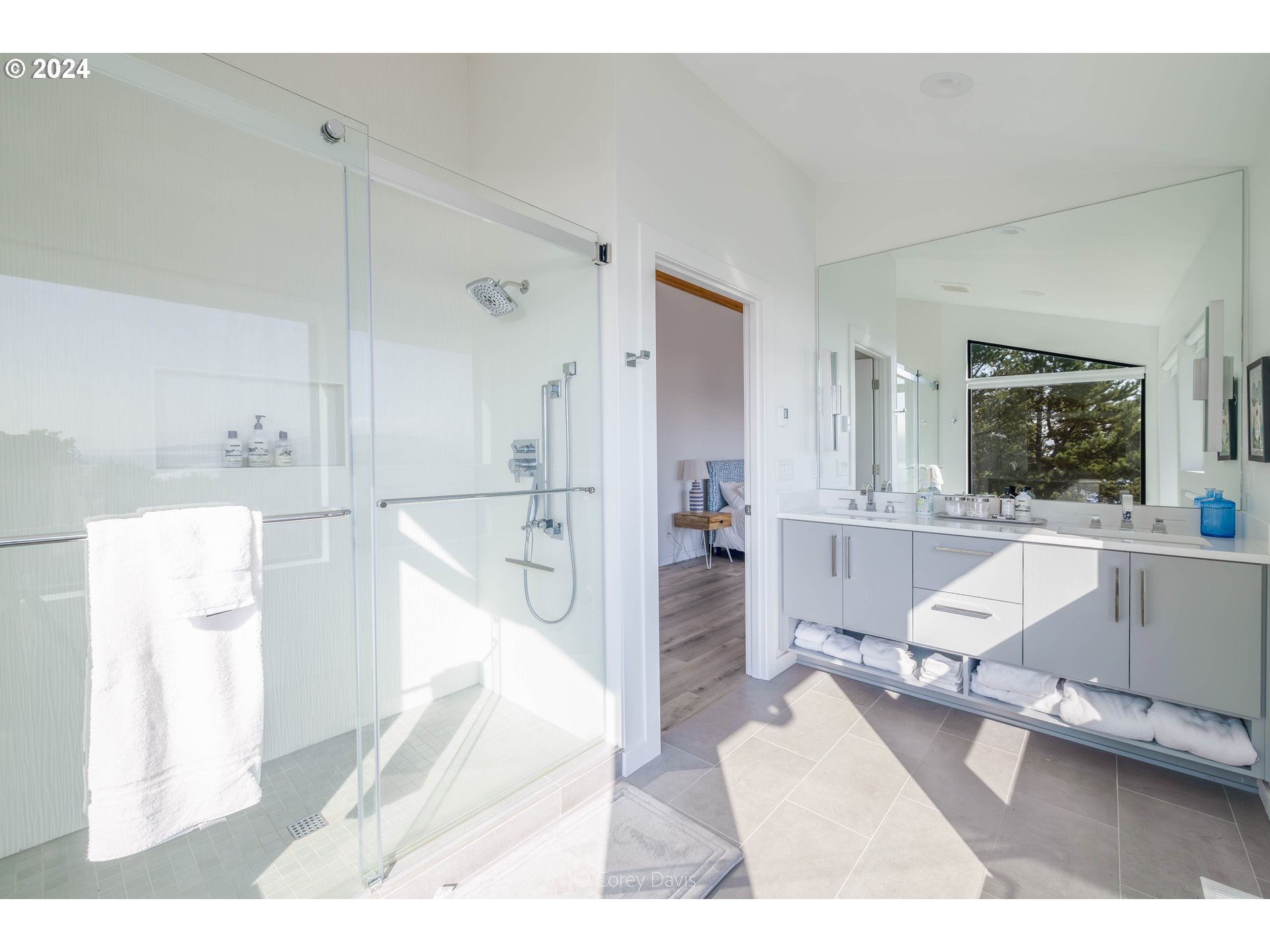 8760 Mariners Nehalem, OR 97131 - Photo 20 of 40 a living room with furniture and a large window