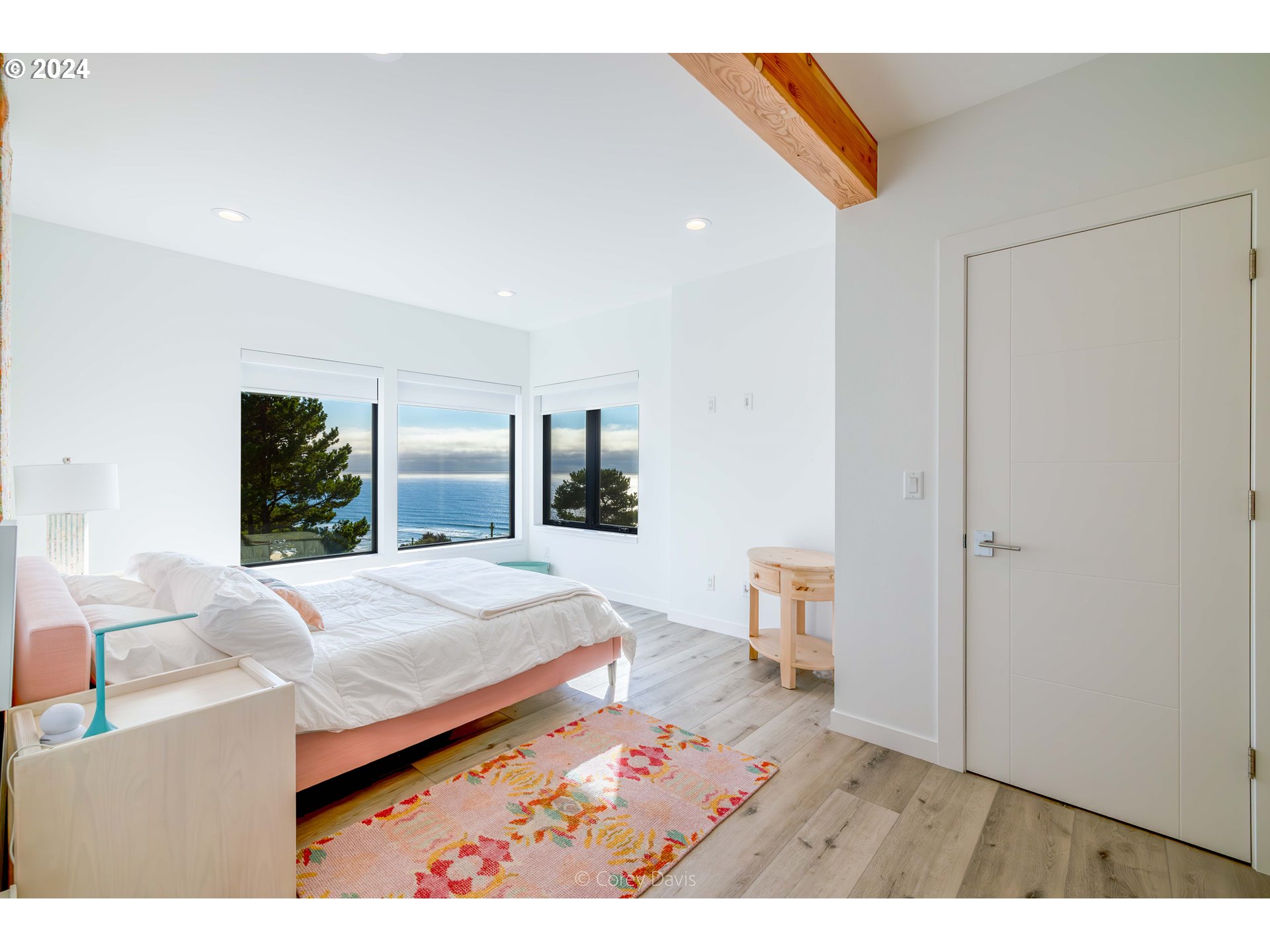 8760 Mariners Nehalem, OR 97131 - Photo 22 of 40 a living room with a bed furniture and a window