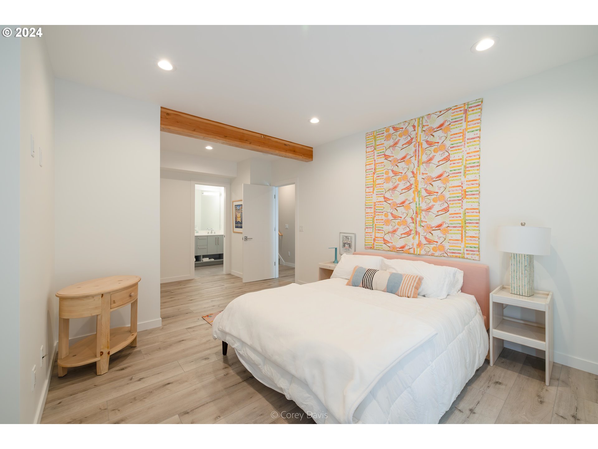 8760 Mariners Nehalem, OR 97131 - Photo 23 of 40 a bedroom with a bed and a painting on the wall
