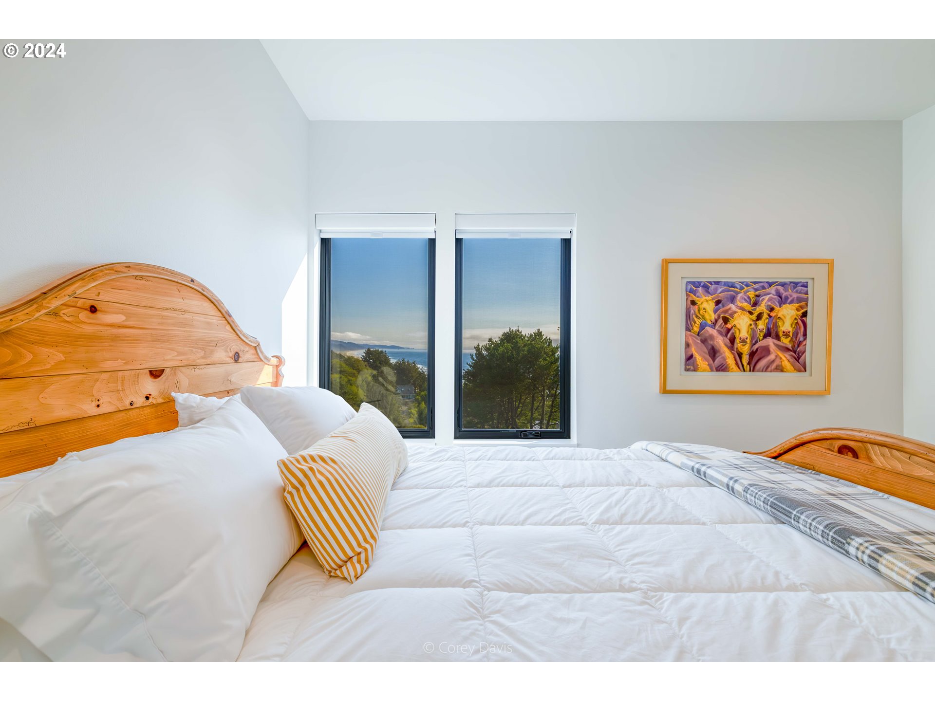 8760 Mariners Nehalem, OR 97131 - Photo 29 of 40 a bedroom with a bed and a painting on the wall