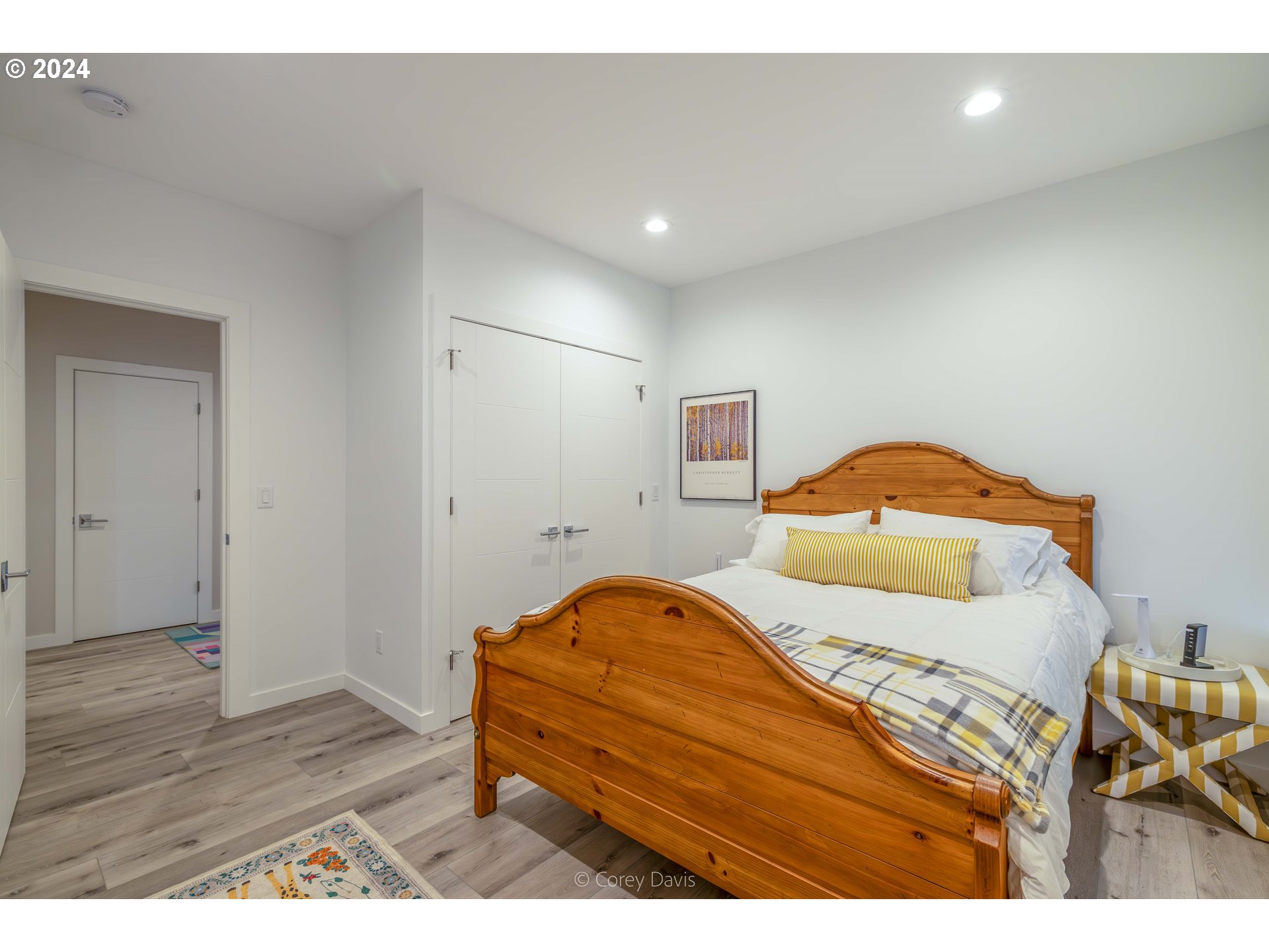 8760 Mariners Nehalem, OR 97131 - Photo 31 of 40 a bedroom with a bed and a wooden floor