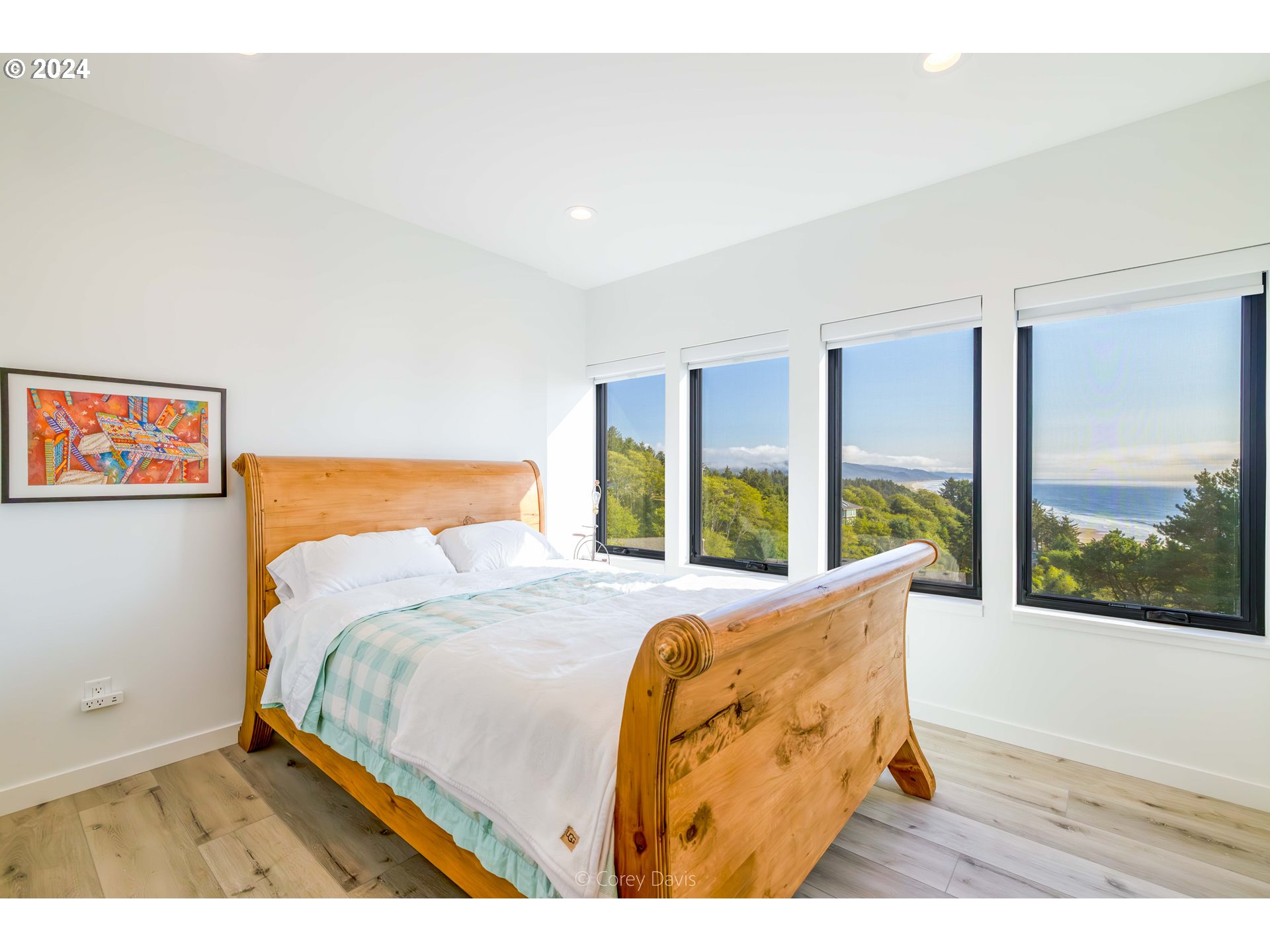 8760 Mariners Nehalem, OR 97131 - Photo 32 of 40 a bed sitting in a bedroom next to a large window