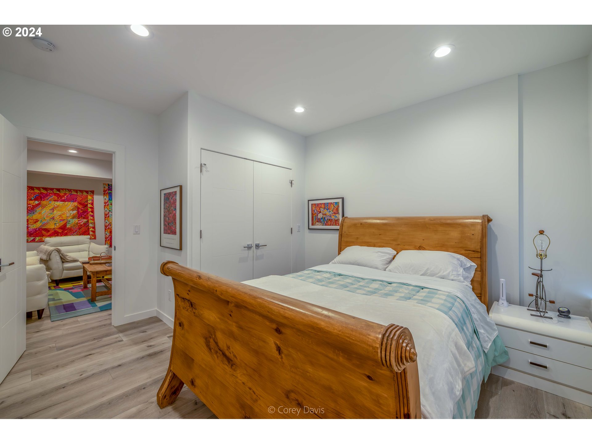 8760 Mariners Nehalem, OR 97131 - Photo 33 of 40 a bedroom with a bed and wooden floor