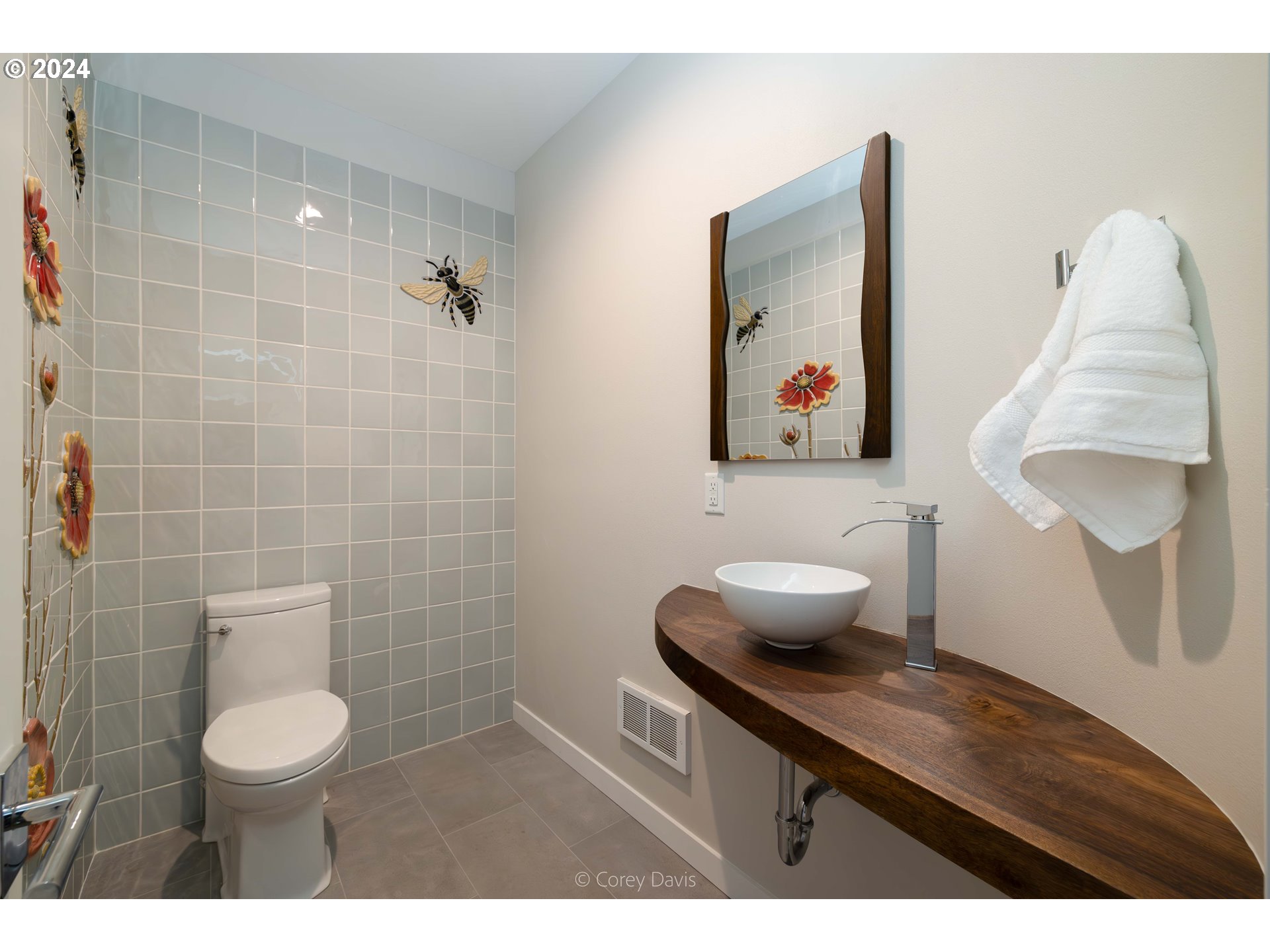8760 Mariners Nehalem, OR 97131 - Photo 38 of 40 a bathroom with a toilet sink and mirror