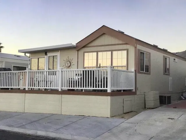 a view of a house with a small yard