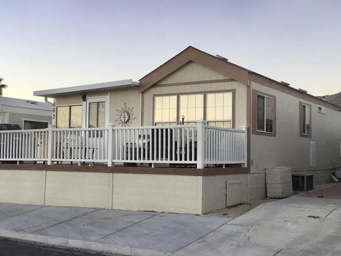 a view of a house with a small yard