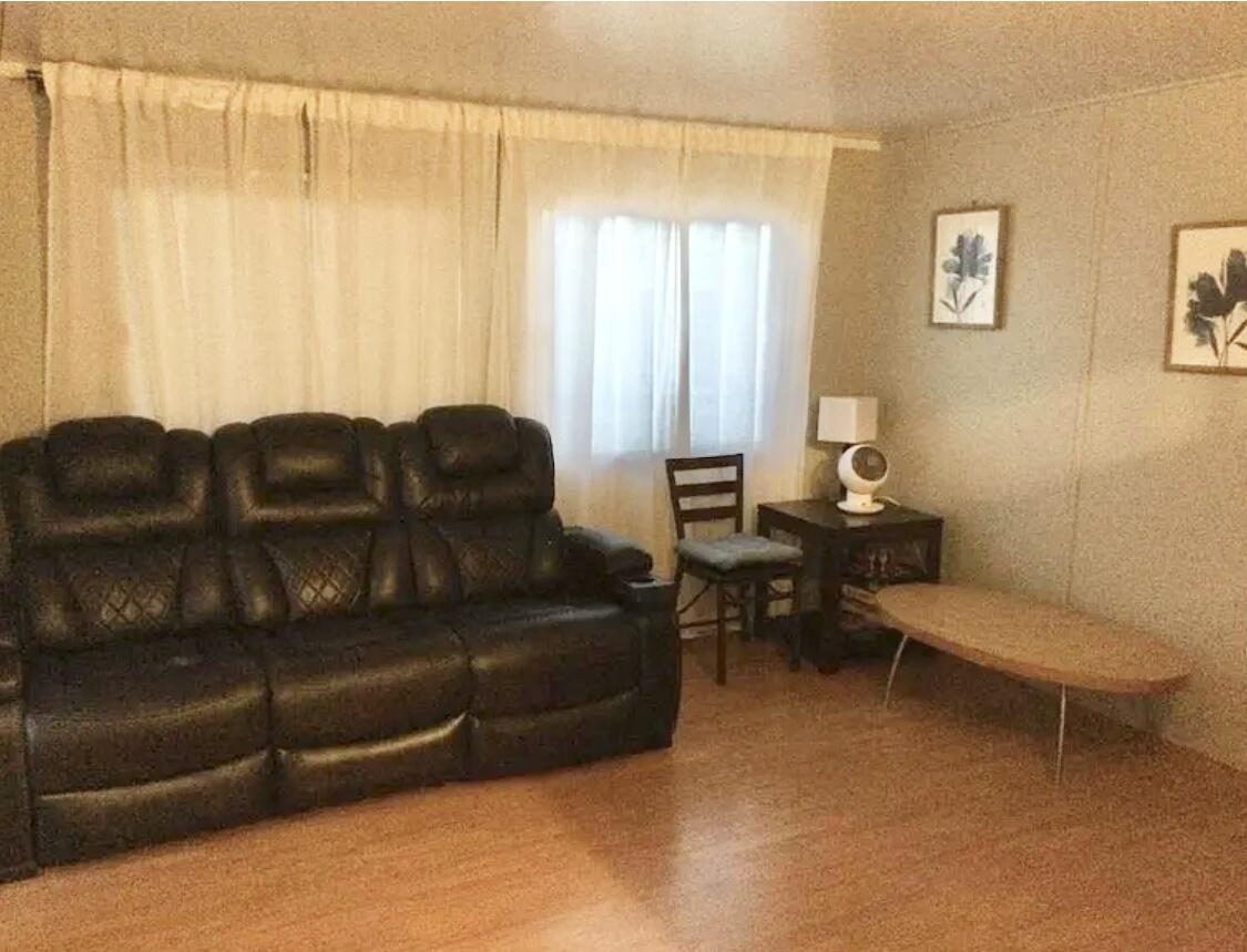 74711 Dillon Road Desert Hot Springs, CA 92241 - Photo 10 of 41 a living room with furniture and a curtain