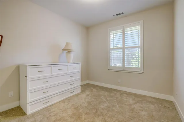 a bathroom with double vanity sinks and a mirror
