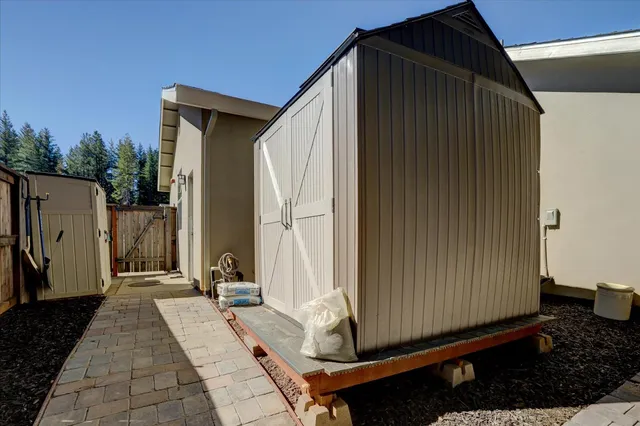 an aerial view of a house with outdoor space