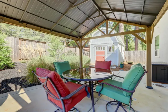 an aerial view of a house with a yard and balcony