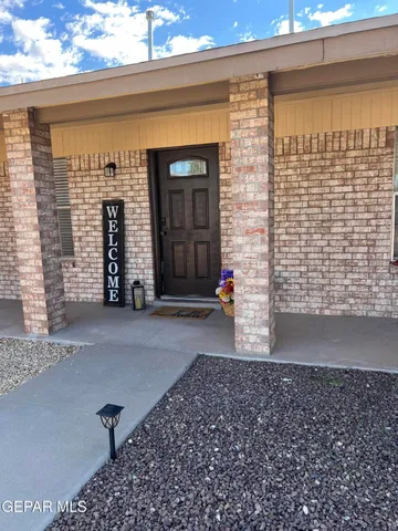 a view of a brick house with a street