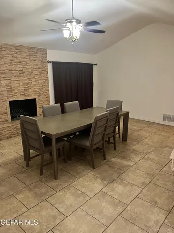 an empty room with a wooden floor and a window