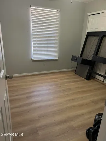 a view of a livingroom with furniture and a flat screen tv