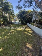 7700 Southwest 56th Avenue, Unit 4 Miami, FL 33143 - Photo 3 of 5 a view of a yard with an outdoor space