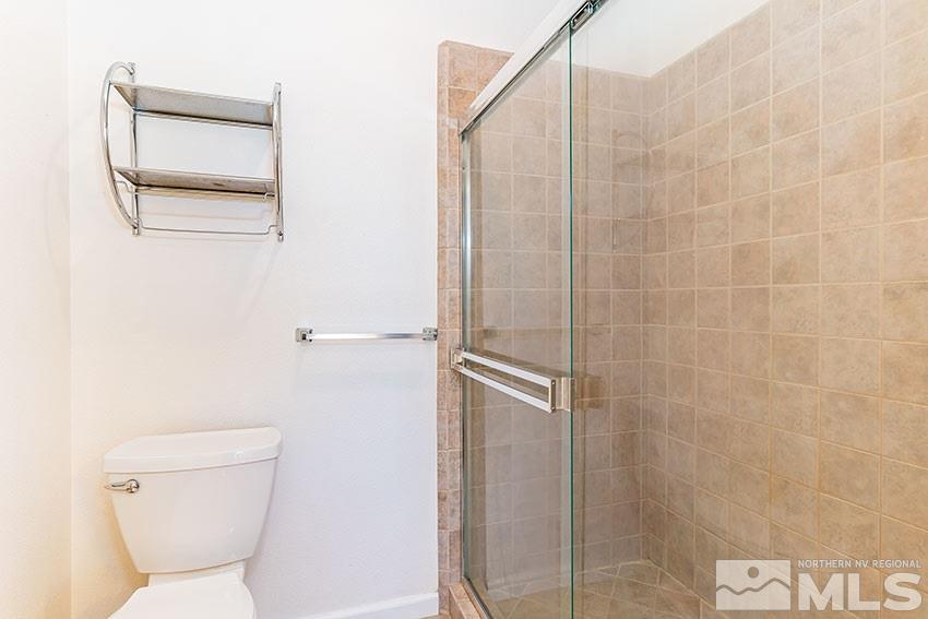 2895 Bryan Street Reno, NV 89503 - Photo 12 of 17 a bathroom with a toilet and a shower