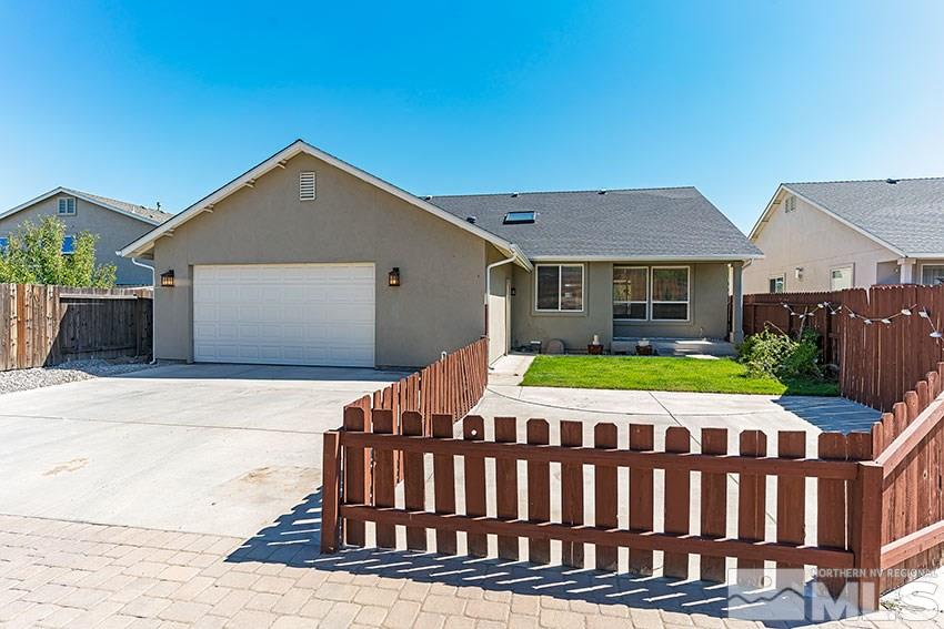 2895 Bryan Street Reno, NV 89503 - Photo 2 of 17 a front view of a house with a garden