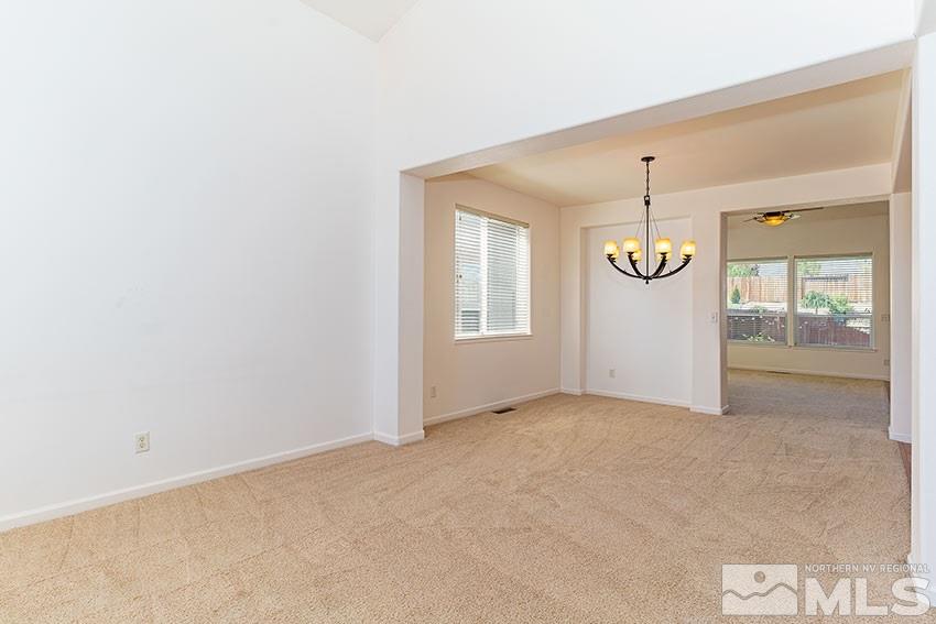 2895 Bryan Street Reno, NV 89503 - Photo 5 of 17 an empty room with a window and wooden floor