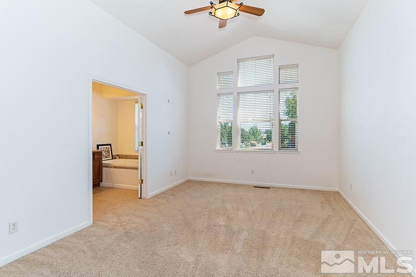 2895 Bryan Street Reno, NV 89503 - Photo 10 of 17 an empty room with a window and a ceiling fan