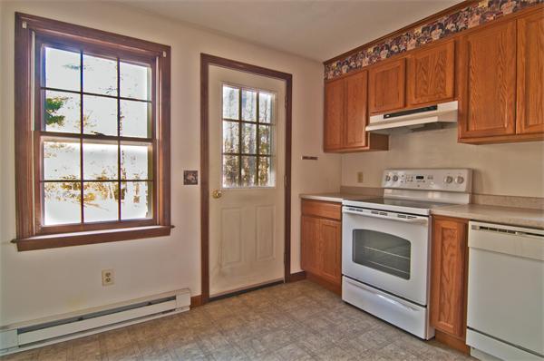 118 Peck Brothers Road Monson, MA 01057 - Photo 8 of 26 a kitchen with granite countertop white cabinets and stainless steel appliances