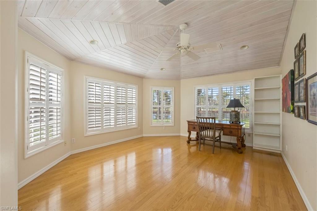 25 Grey Wing Point Naples, FL 34113 - Photo 13 of 25 a view of a dining room with furniture wooden floor and a rug