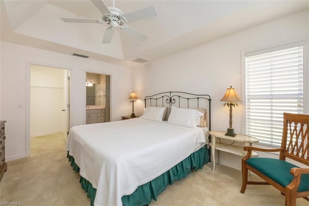 25 Grey Wing Point Naples, FL 34113 - Photo 21 of 25 a bedroom with a bed table and chair