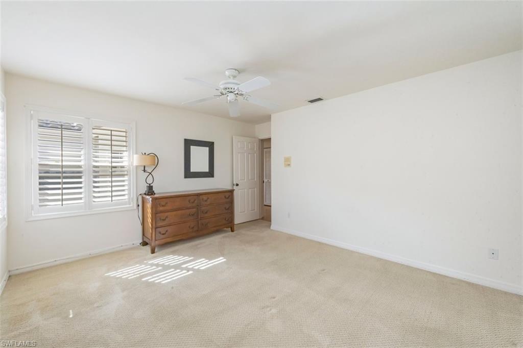 25 Grey Wing Point Naples, FL 34113 - Photo 24 of 25 a view of an empty room with a window