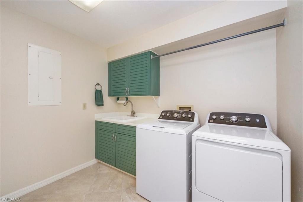 25 Grey Wing Point Naples, FL 34113 - Photo 25 of 25 a utility room with dryer and washer